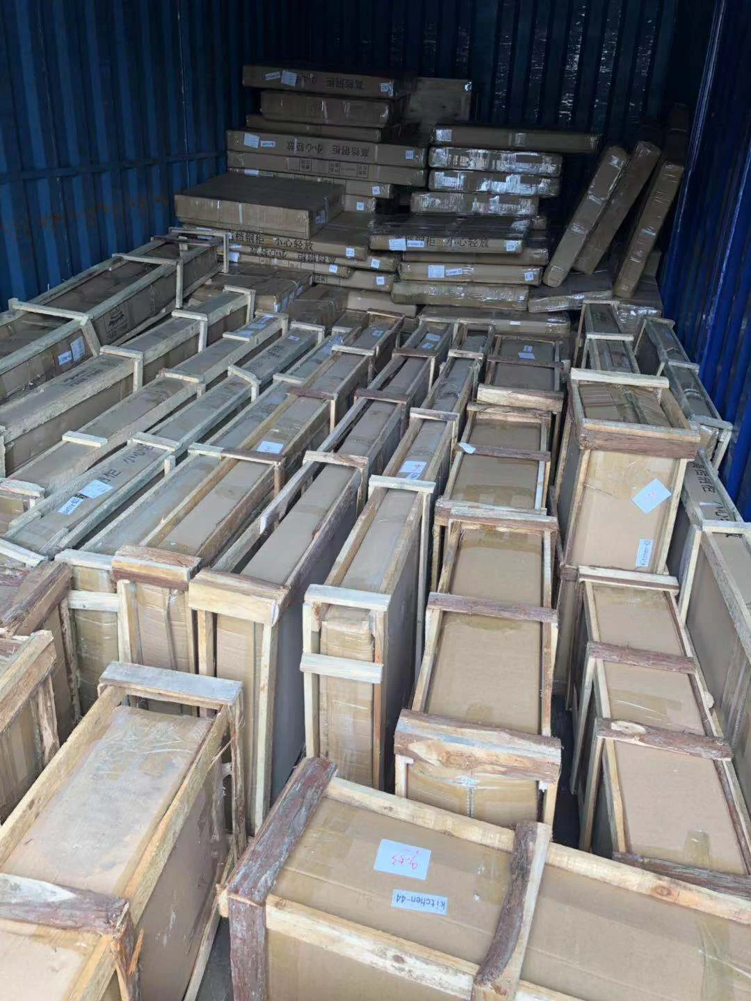 Wooden-crated products packed inside a shipping container
